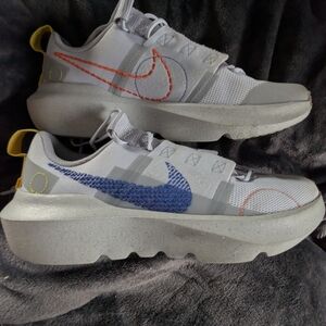 Nike Women’s Sneakers in White with Blue and Orange Accents